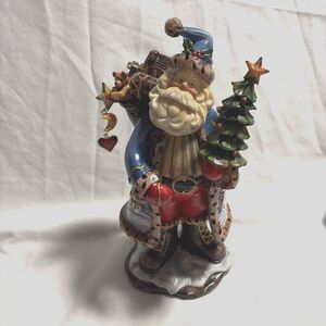 Christmas Santa Holding A Tree With A Bag Of Toys On His Back like Like It Like